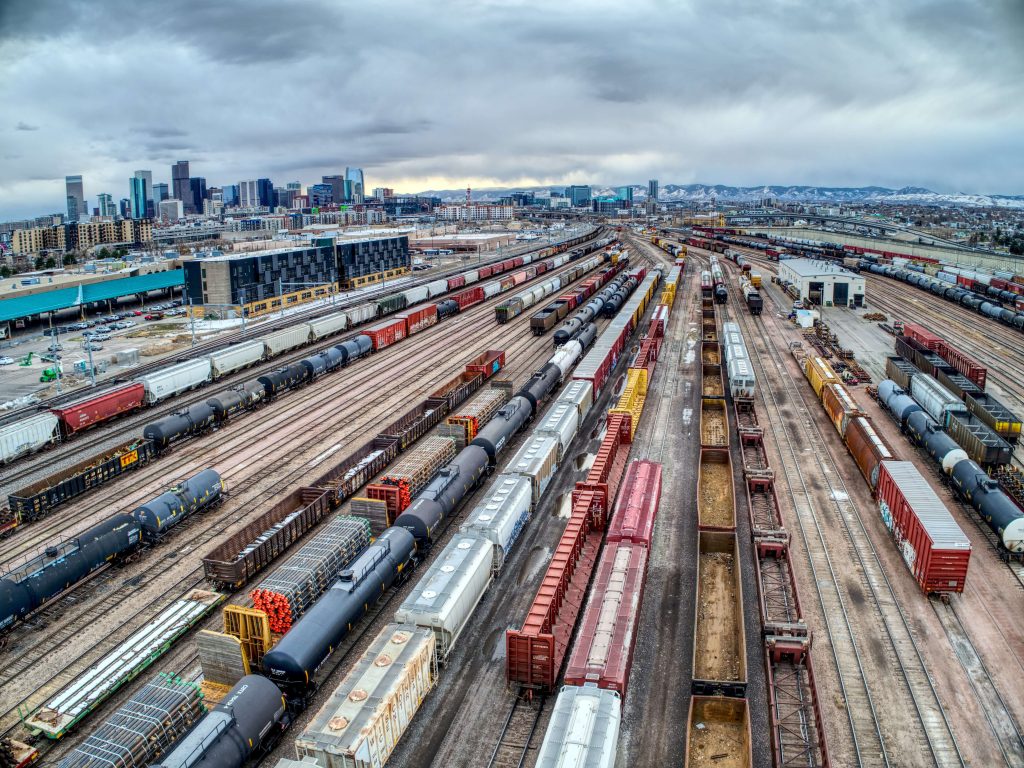 freight trains on traintracks going to a container depot