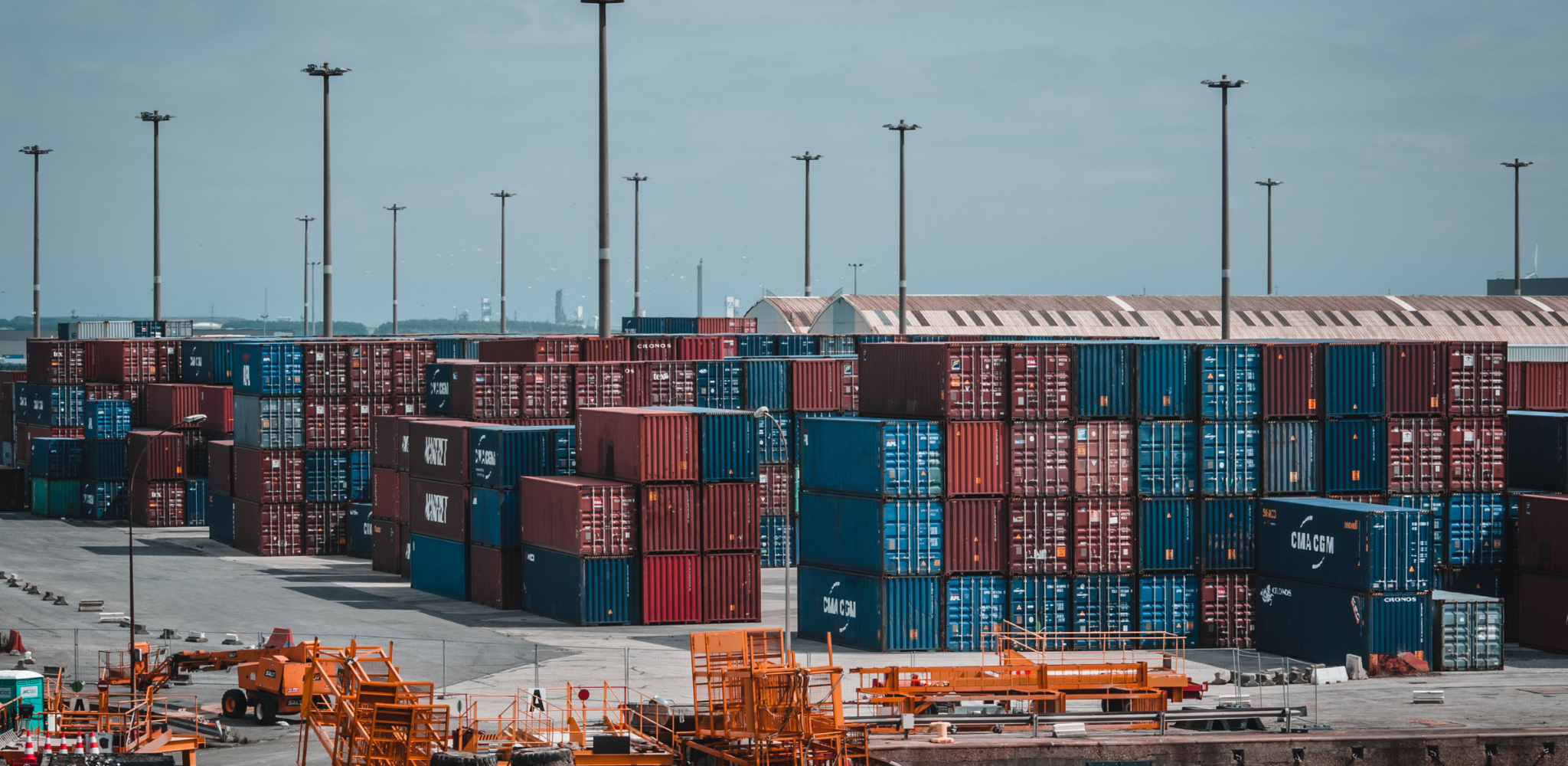 Containers at a port stacked